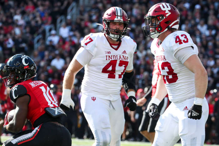 Indiana redshirt freshman linebacker Matt Hohlt (43) celebrates a tackle with JH Tevis (47) during Indiana's game against Cincinnati at Nippert Stadium on Sept. 24.